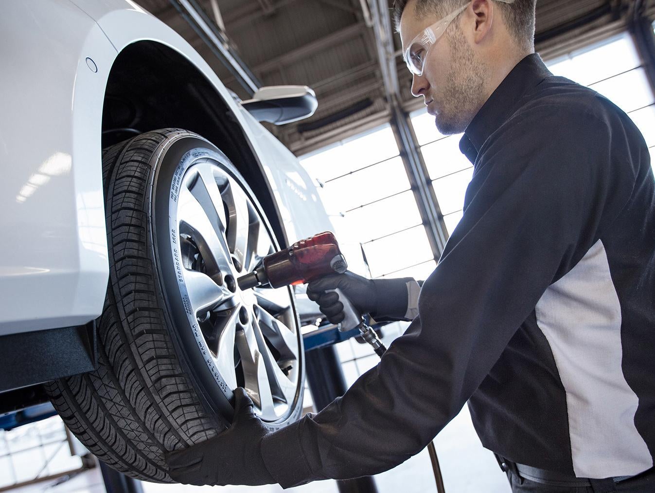 Certified Technicians Performing Tire Installation
