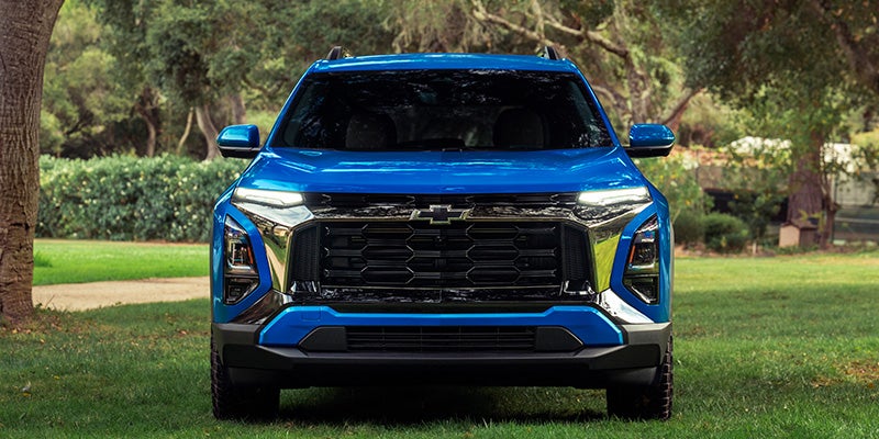 Front view of a 2027 Chevrolet Equinox LT in Reef Blue Metallic showing LED lighting and safety sensors