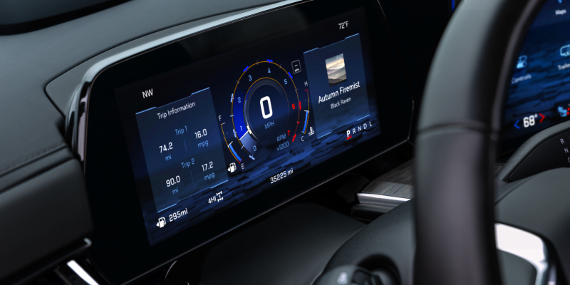 2027 Chevrolet Tahoe standard 11-inch digital Driver Information Center displaying trip economy, 4HI status, and tachometer