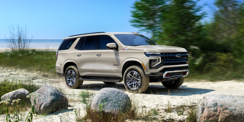 2027 Chevrolet Tahoe Z71 in new White Sands paint with Red recovery hooks and 20-inch all-terrain tires